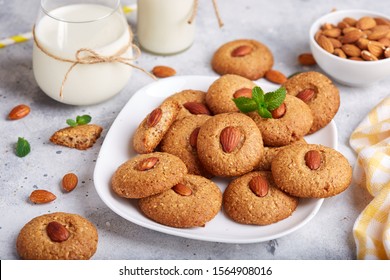 Delicious homemade almond cookies, served with glass of milk - Powered by Shutterstock