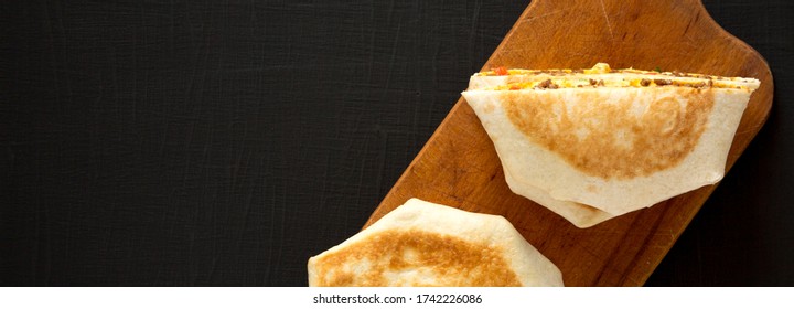 Delicious Homemade Beef Crunchwrap Quesadilla, Top View. Flat Lay, Overhead, From Above. Space For Text.