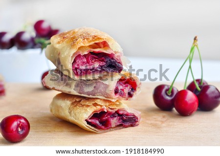 Delicious Homemade Cherry Pie.Sweet slices of cherry strudel on a wooden table. Traditional cuisine. 