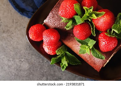 Delicious Homemade Chocolate Cake With Strawberries And Mint. Dark Background. Celebratory Dinner