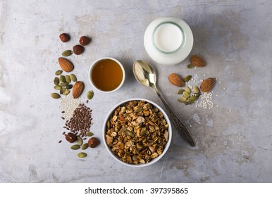 Delicious homemade nutty granola with a bottle of milk 