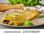 Delicious Homemade Omelette: Fresh Ingredients with Cheese, Mushrooms, and Vegetables.