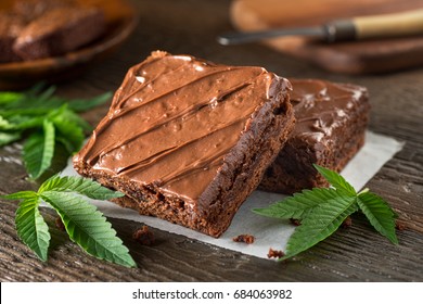 Delicious Homemade Pot Brownies With Marijuana Leaf Garnish.