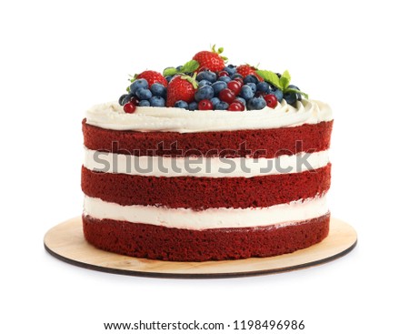 Delicious homemade red velvet cake with fresh berries on white background