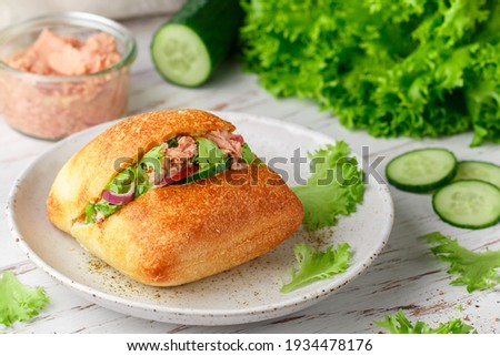 Similar – Mediterranean lunch or dinner with roasted dorado fishes, homemade focaccia bread , olive oil and olives served on rustic table with tableware and kitchen utensils, top view.