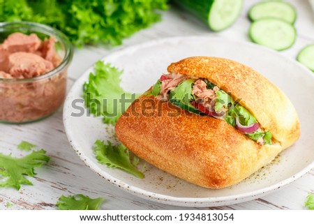 Similar – Mediterranean lunch or dinner with roasted dorado fishes, homemade focaccia bread , olive oil and olives served on rustic table with tableware and kitchen utensils, top view.