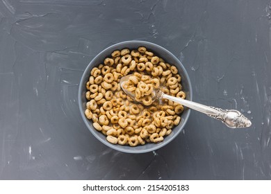 Delicious Honey Cheerios Cereal In Bowl With Milk And Spoon, Copy Space