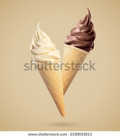 Delicious ice cream in crispy cones falling on pastel light brown background