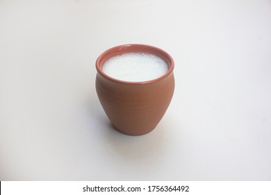 Delicious Indian popular drink Lassi made with curd and sugar. Street food and refreshment drink. served in the traditional pot (Clay Cup). 