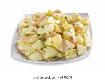 Delicious Isolated Dish Of Potato Salad, With Sliced Ham And Parsley