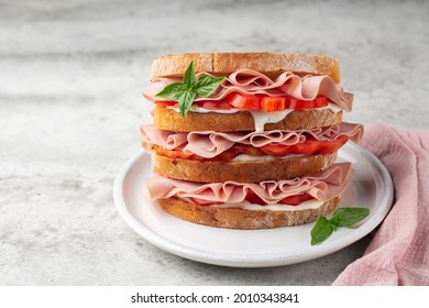 Delicious Italian Deli Sandwich With Mortadella, Soft Cheese Stracchino And Tomatoes. 