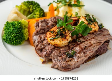 Delicious Juicy Grilled Steak And Shrimp With Grilled Broccoli And Cauliflower.  Surf And Turf Style. 