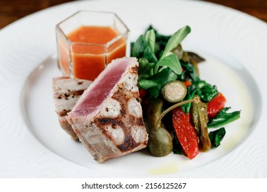 Delicious And Juicy Grilled Tuna Steak With Roasted Peppers, Spinach And Tomato Salsa