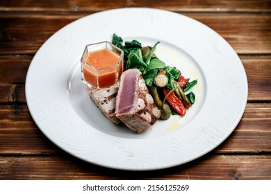 Delicious And Juicy Grilled Tuna Steak With Roasted Peppers, Spinach And Tomato Salsa