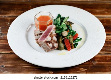 Delicious And Juicy Grilled Tuna Steak With Roasted Peppers, Spinach And Tomato Salsa