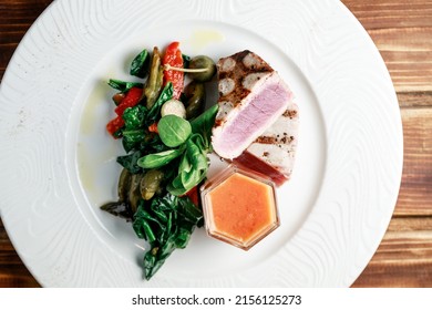 Delicious And Juicy Grilled Tuna Steak With Roasted Peppers, Spinach And Tomato Salsa