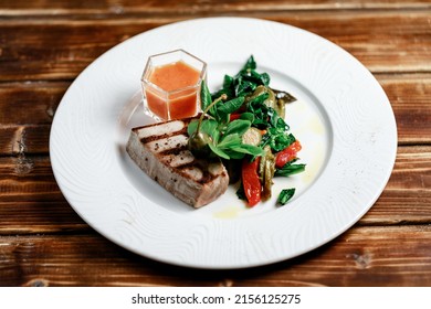 Delicious And Juicy Grilled Tuna Steak With Roasted Peppers, Spinach And Tomato Salsa