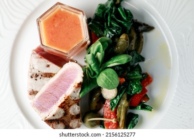 Delicious And Juicy Grilled Tuna Steak With Roasted Peppers, Spinach And Tomato Salsa