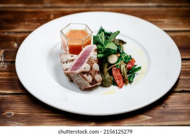 Delicious And Juicy Grilled Tuna Steak With Roasted Peppers, Spinach And Tomato Salsa