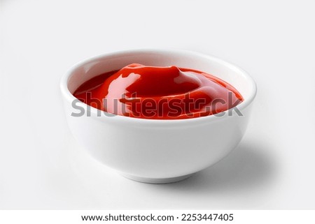 Delicious ketchup in white bowl isolated on white background. Portion of tomato sauce with clipping path. Collection of various sauces