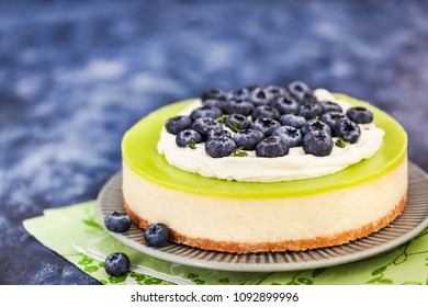 Delicious Key Lime Cheesecake Decorated With Fresh Blueberries