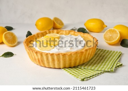 Delicious lemon tart on light background