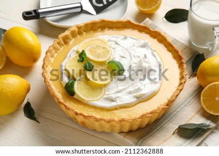 Delicious lemon tart on table