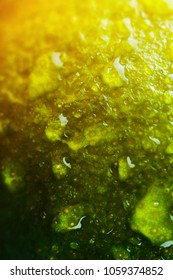 Delicious lime close up as a texture with drops of water. Shallow deph of field