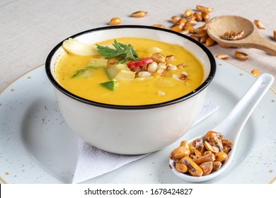 Delicious "locro de papa" an Ecuadorian gastronomic tradition, made with various types of potatoes, cheese and accompanied with toasted corn - Shutterstock ID 1678424827