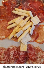 Delicious Looking Cured Meat Platter With Small Cracker Biscuits And Sticks