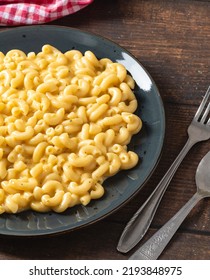 Delicious Mac N Cheese Or Macaroni And Cheese On A Black Porcelain Plate