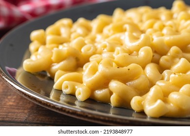 Delicious Mac N Cheese Or Macaroni And Cheese On A Black Porcelain Plate