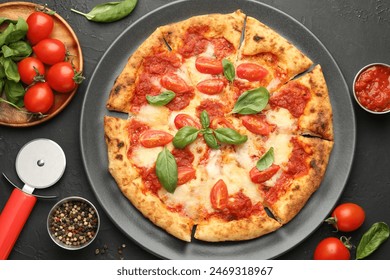 Delicious Margherita pizza, ingredients and cutter on black table, top view - Powered by Shutterstock