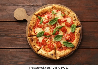 Delicious Margherita pizza on wooden table, top view