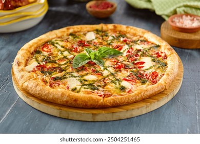 Delicious Margherita Pizza with Pesto Sauce on Wooden Board - Authentic Italian Cuisine. - Powered by Shutterstock