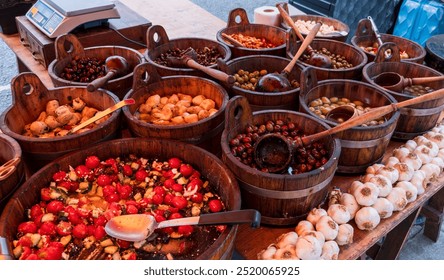 Delicious Mediterranean food display at Notting Hill Market, London – Fresh olives, marinated vegetables, and garlic in rustic wooden bowls for culinary and cultural themes - Powered by Shutterstock