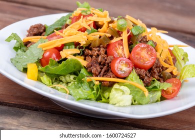 Delicious Mexican Beef Taco Salad Bowl Dish Closeup On Wood Table