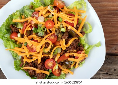 Delicious Mexican Beef Taco Salad Bowl Dish Closeup On Wood Table