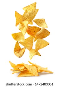 Delicious Mexican nachos chips falling into pile on white background