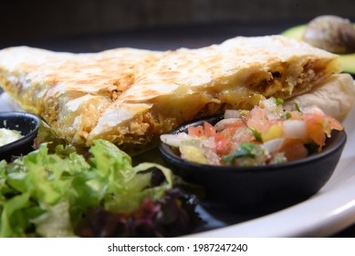 Delicious Mexican Quesadilla With Chicken Stuffing And Vegetable Salad