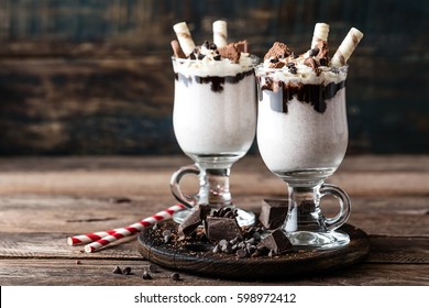 delicious milkshake with ice cream, chocolate and cookies