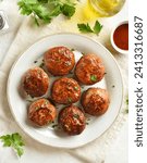 Delicious minced pork and beef cutlets on plate over light background. Comfort food. Top view, flat lay