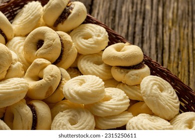 

Delicious mini butter flavored milk and guava cookies with a cup of coffee served in elegant jars on top of a rustic wood or white marble table, top view and selective focus - Shutterstock ID 2315250611