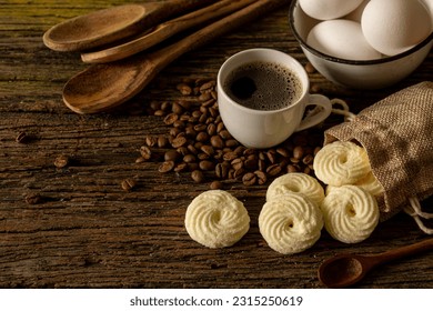 

Delicious mini butter flavored milk and guava cookies with a cup of coffee served in elegant jars on top of a rustic wood or white marble table, top view and selective focus - Shutterstock ID 2315250619