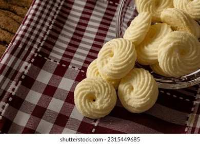 

Delicious mini butter flavored milk and (Sequilhos) guava cookies with a cup of coffee served in elegant jars on top of a rustic wood or white marble table, top view and selective focus - Shutterstock ID 2315449685