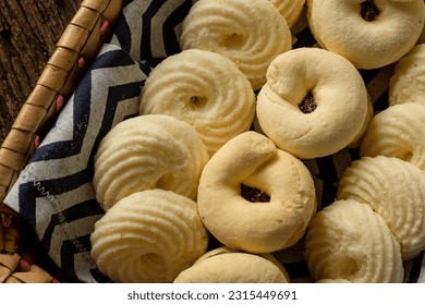 

Delicious mini butter flavored milk and (Sequilhos) guava cookies with a cup of coffee served in elegant jars on top of a rustic wood or white marble table, top view and selective focus - Shutterstock ID 2315449691