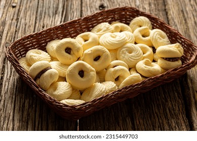 

Delicious mini butter flavored milk and (Sequilhos) guava cookies with a cup of coffee served in elegant jars on top of a rustic wood or white marble table, top view and selective focus - Shutterstock ID 2315449703