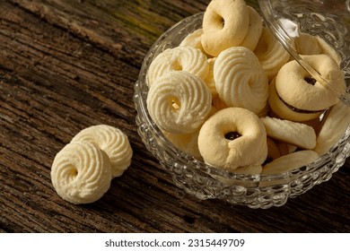 

Delicious mini butter flavored milk and (Sequilhos) guava cookies with a cup of coffee served in elegant jars on top of a rustic wood or white marble table, top view and selective focus - Shutterstock ID 2315449709