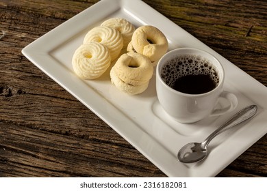 

Delicious mini butter flavored milk and guava cookies with a cup of coffee served in elegant jars on top of a rustic wood or white marble table, top view and selective focus - Shutterstock ID 2316182081