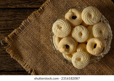 

Delicious mini butter flavored milk and guava cookies with a cup of coffee served in elegant jars on top of a rustic wood or white marble table, top view and selective focus - Shutterstock ID 2316182087